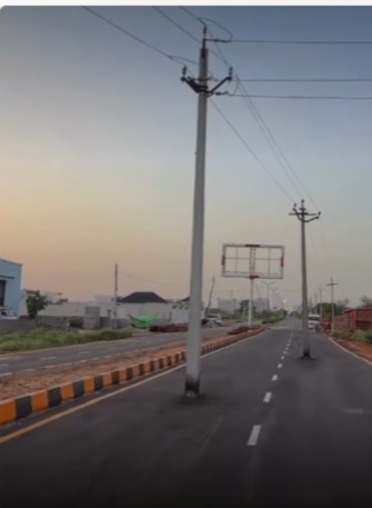 Newly built road goes viral after electric poles were left standing right in the middle